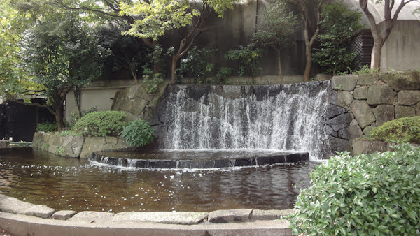 a small waterfall feature in the park